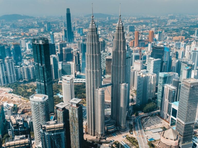 Aerial view of Kuala Lumpur skyline with Petronas Twin Towers at the centre