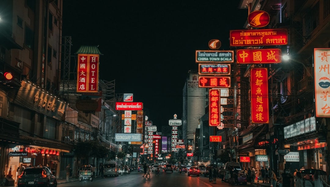 Yaowarat Road Bangkok Chinatown at night with glowing neon signs and busy street traffic