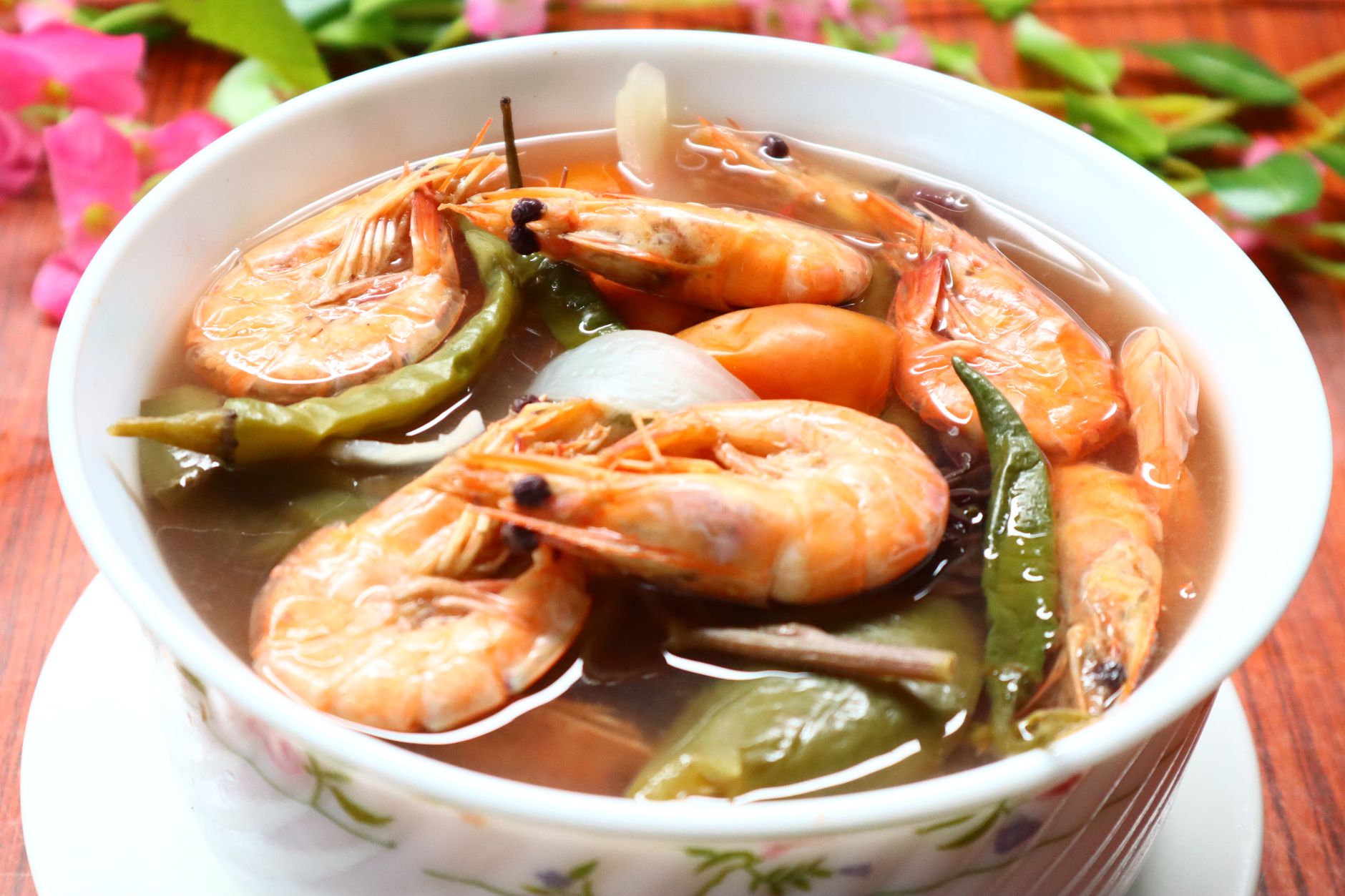 A bowl of Filipino sinigang na hipon, a sour tamarind soup with fresh shrimp and vegetables — one of the Philippines' most beloved dishes