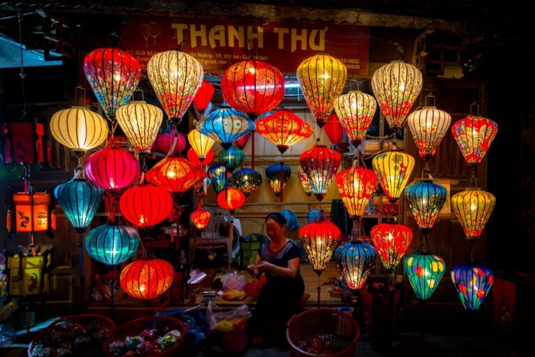Colorful silk lanterns glowing at night in Hoi An's Old Town market, Vietnam